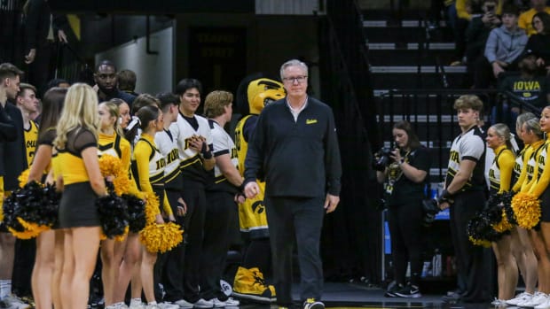Iowa coach Fran McCaffery walks onto the court during Senior Day ceremonies before a game against Illinois on March 10, 2024 at Carver-Hawkeye Arena in Iowa City, Iowa. (Rob Howe/HN)